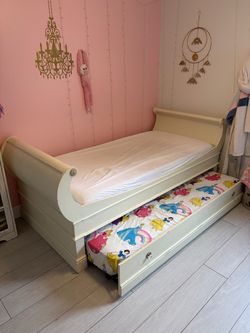 Twin trundled bed. Solid wood. With mattresses.