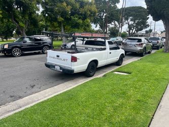 Chevrolet S-10 White Pickup Truck with Rack