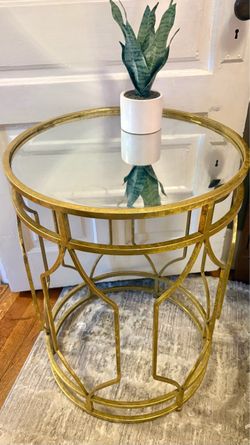 Gold metal accent table with mirror top