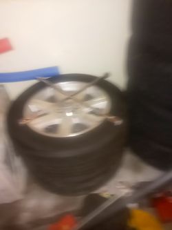 2 dodge chargers factory rims and tire