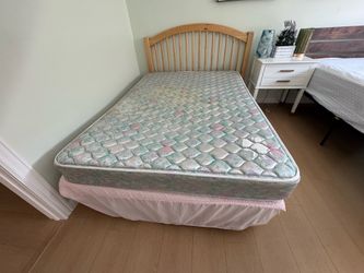Full-size bed with head board
