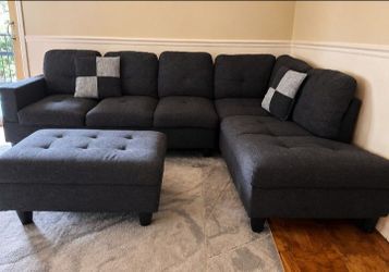 Comfortable dark grey L-shape sectional couch + storage ottoman