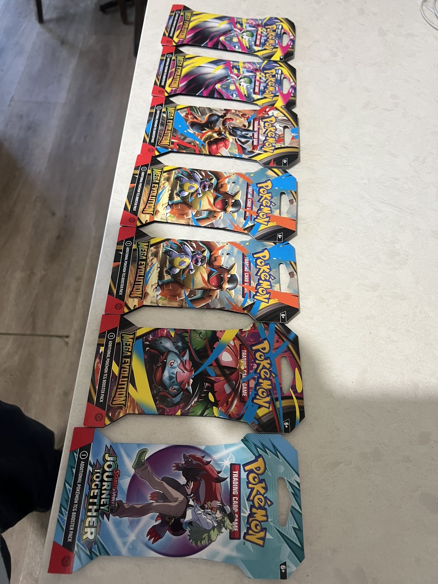 Surging Sparks ETB, Prismatic Mini Tins , Mega Evolutions Booster Bundles.