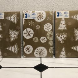 New in original sealed packaging  3 pacsk of three gift boxes with a snowflake pattern.