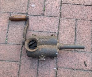 antique cast-iron "cigar" grinder is a hand-cranked tobacco shredder or cutter patented on March 15, 1859. It was designed to shred whole dried leaves