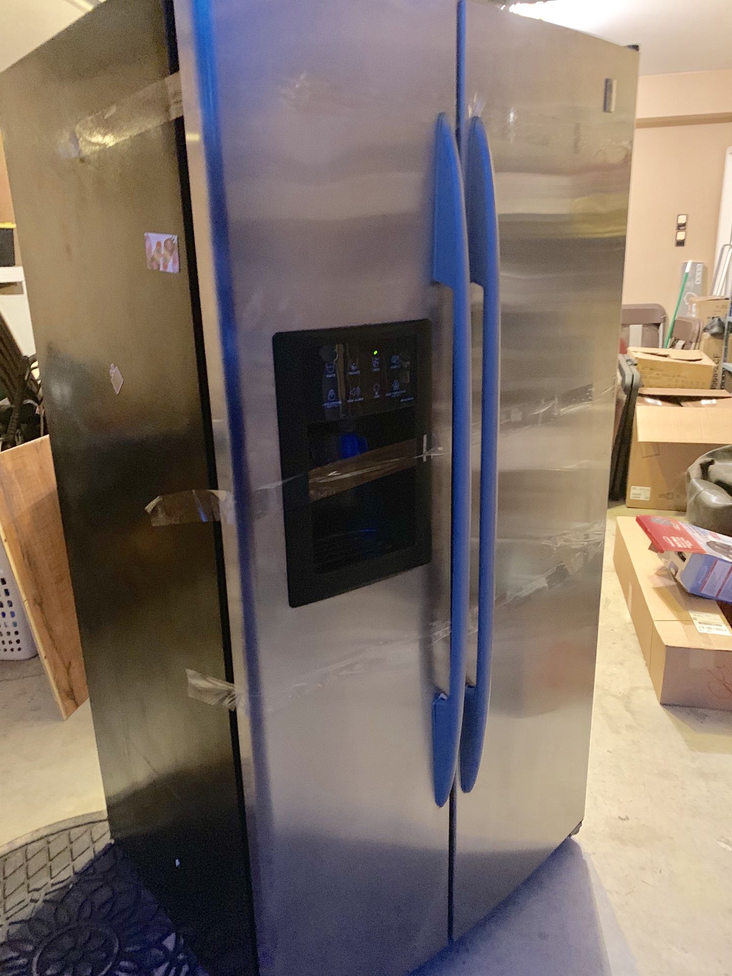 General Electric stainless steel side-by-side refrigerator.