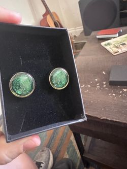 4 pairs of green and gold cufflinks