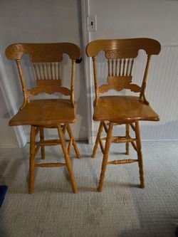 Oak swivel stools.