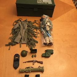 Hasbro G.I. Joe 12-inch action figure set, which is a vintage collectible.  It includes a soldier figure, a storage footlocker, and various accessorie