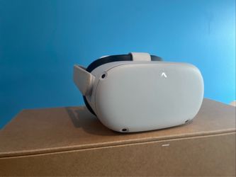 Meta Quest 2 VR headset with controllers and original box + free added on pro controller grips