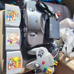Nintendo 64 with
Mario party
Mario golf
Mario tennis
2 controllers and cords
Working perfectly. 