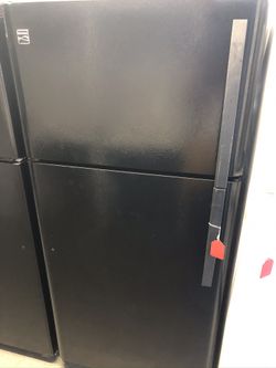 Used kenmore 18 cu ft top and bottom fridge. 1 year warranty