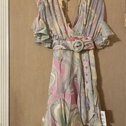 Brand new adorable women’s size XS floral dress with belt. Open back. Very unique  