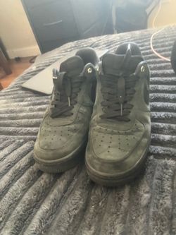 Black/green Air Force’s size 9.5