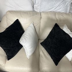 Leather loveseat without cushions.