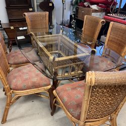 glass top bamboo dining table with six matching chairs. 