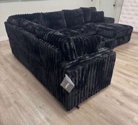 Black Fabric Sectional with Pull-Out Bed and Storage Chaise. Brand New.