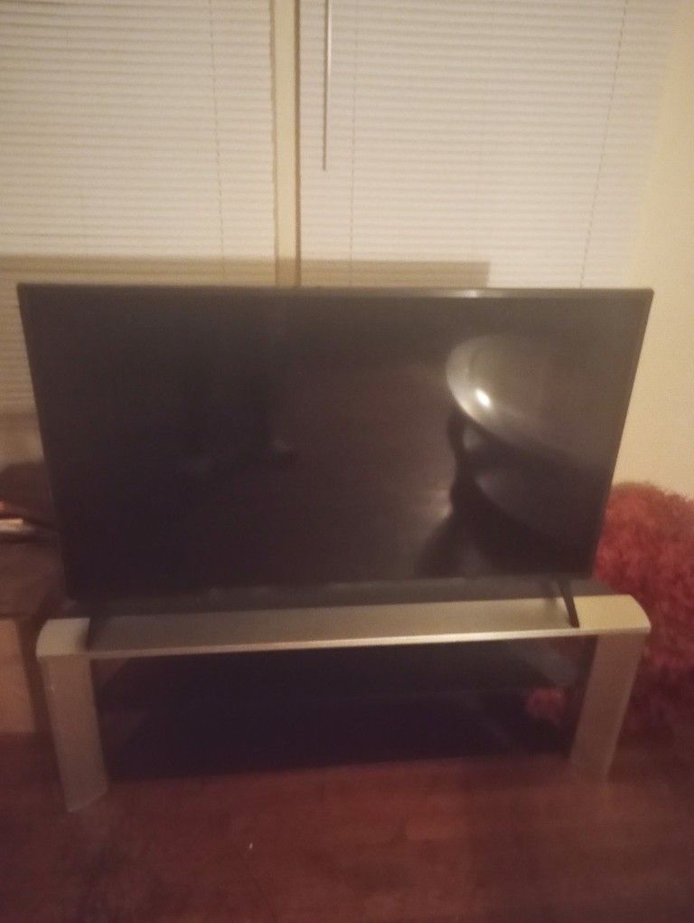 2 Recliner Couch and Loveseat with tables and lamps Plus55 In tv and stand. Will sell all for 450.00