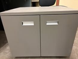 Grey metal cabinet on wheels