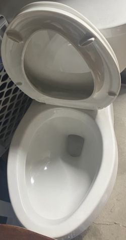 Elongated Toilet- New- Firm Price