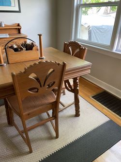 Antique table and 4 chairs. All wood