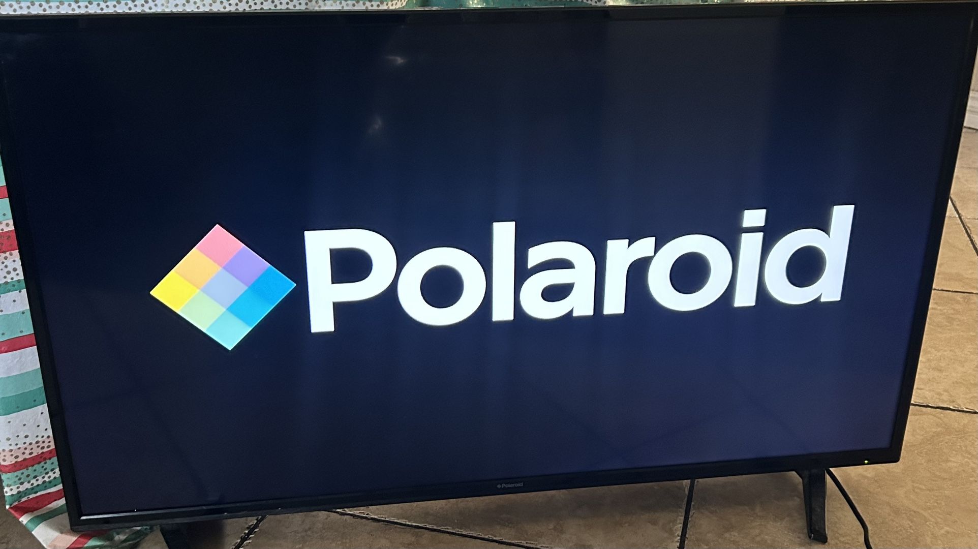 Polaroid TV/monitor, 36” x 20”
