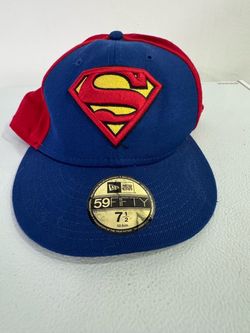 The Superman Two-Tone 59FIFTY Fitted Cap features an embroidered Superman logo at the front panels with the DC logo at the rear and a red undervisor. 