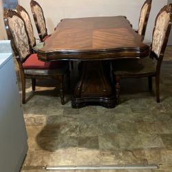 Brown Wood(heavy) Table With Five Cloth Chiars. ( Need To Be Cleaned)