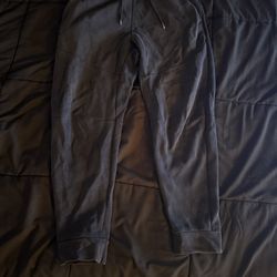 Black Nike tech pants