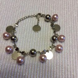 Pink and silver colored bracelet