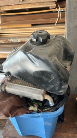 Suzuki quad fuel tank and radiator with fans.