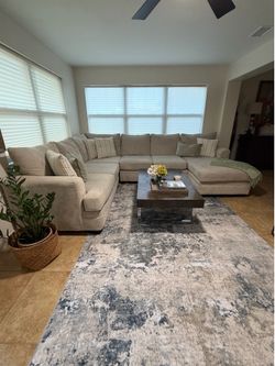 Sectional sofa,coffee table and carpet.