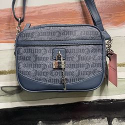 New Juicy Couture blue denim crossbody bag Eastside Westside camera crossbody bag Color is denim blue  New with tags  Straps can be adjusted