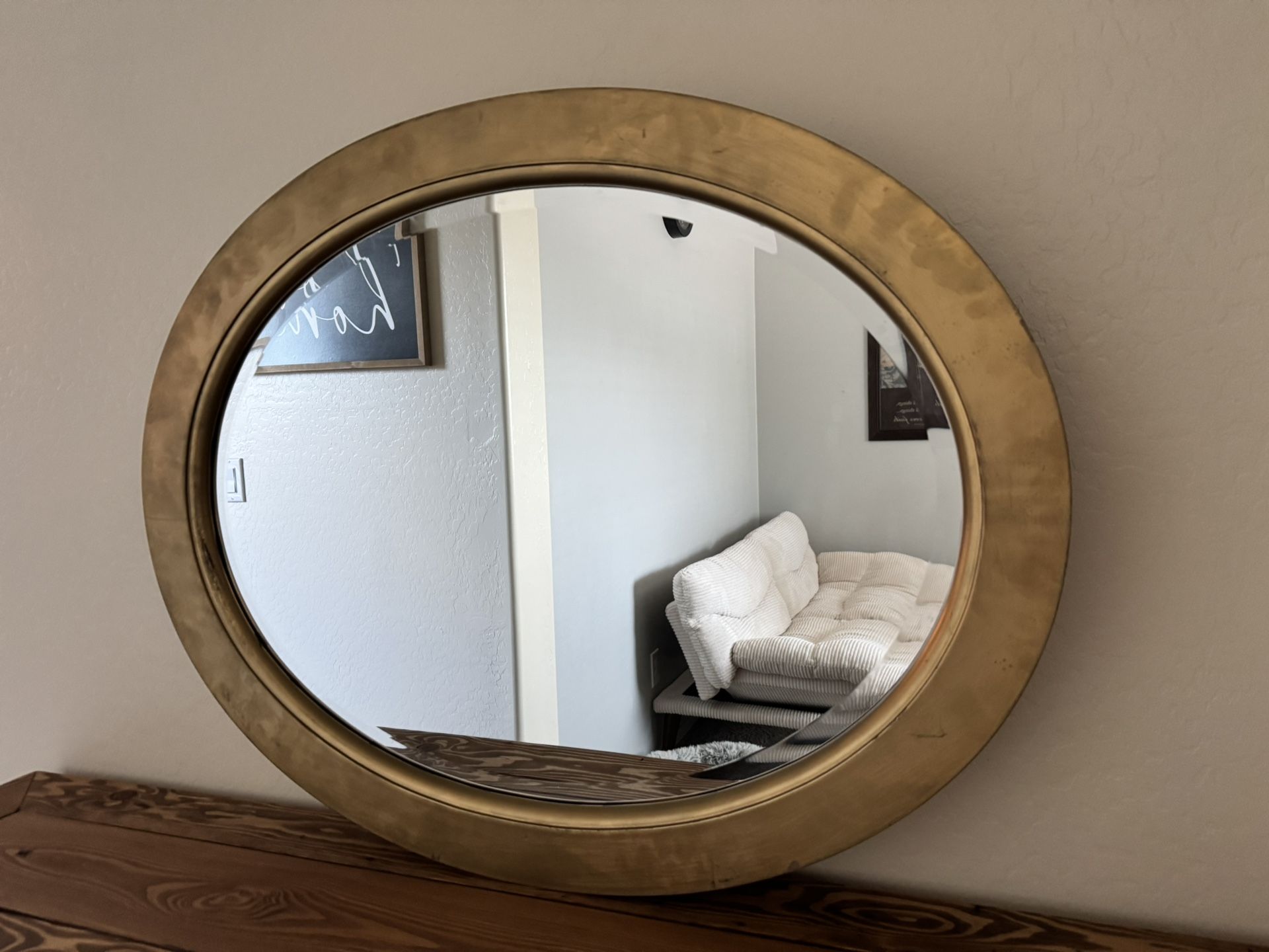 Oval gold mirror