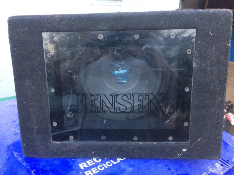 A Jensen 10" car subwoofer in carpeted box. This black car 10" subwoofer features XS bass, 525 speaker wattage, and connectors in the back. C