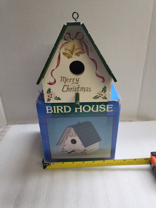 Two Christmas birdhouses and a wind chime