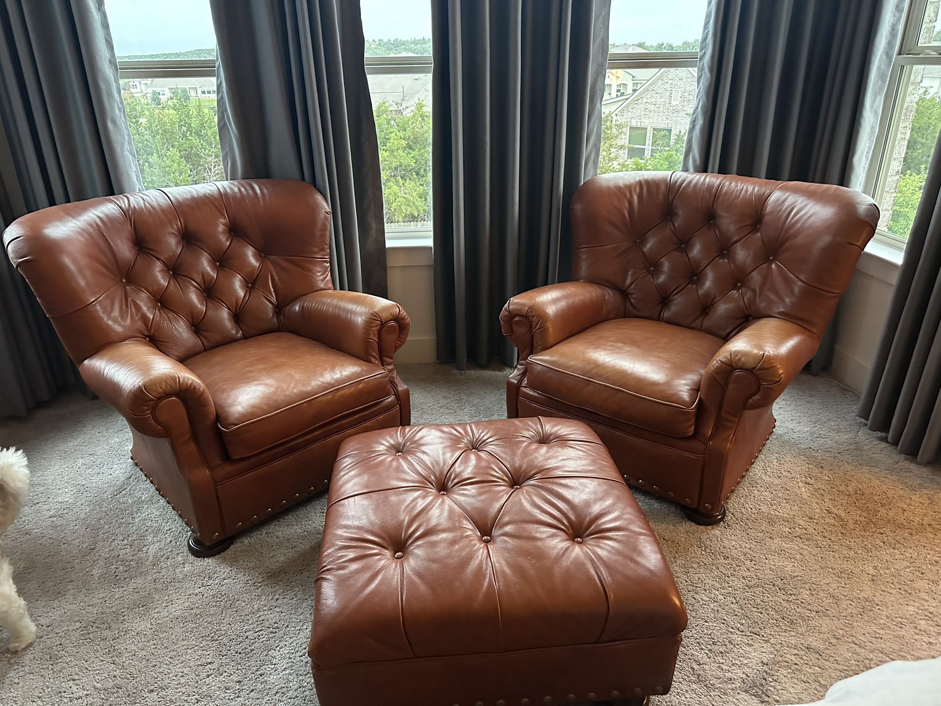 Two Leather Chairs With Ottoman 