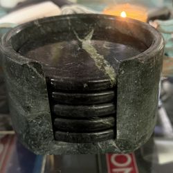 vintage green marble coasters with a holder, possibly from the brand Studio Nova.