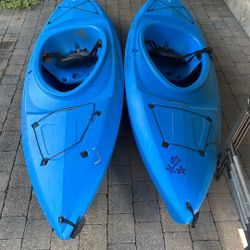 Two Kayaks With Paddles & Life Jackets