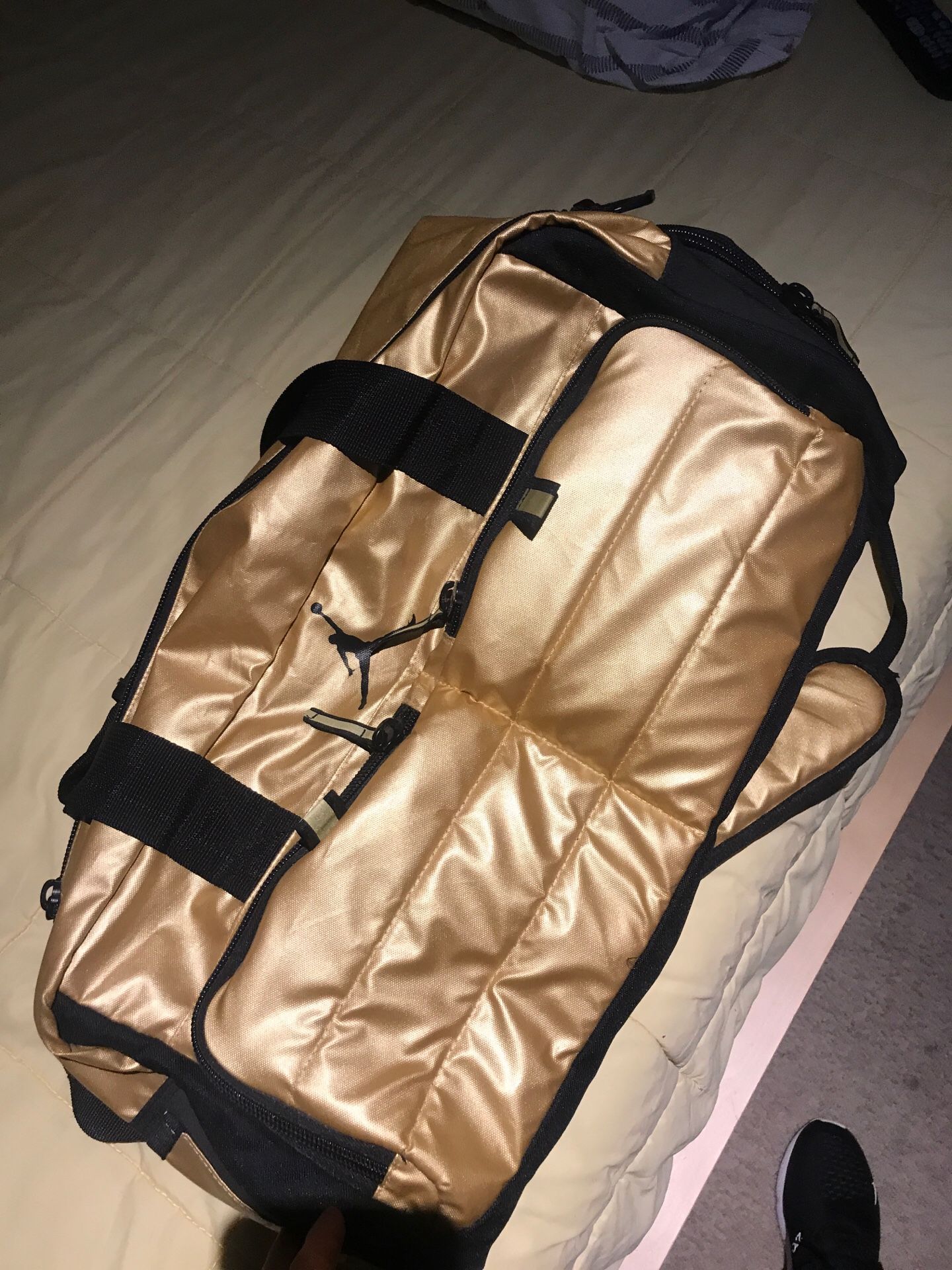 Jordan gold and black duffel bag