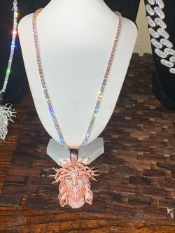 Beautiful iced out rosegold 20in tennis chain with Jesus pendant