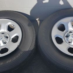 (4) Nissan Titan / Armada Original Steel Wheels Rims + Caps 18"