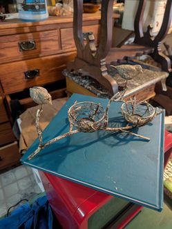Two birds on a branch sculpture