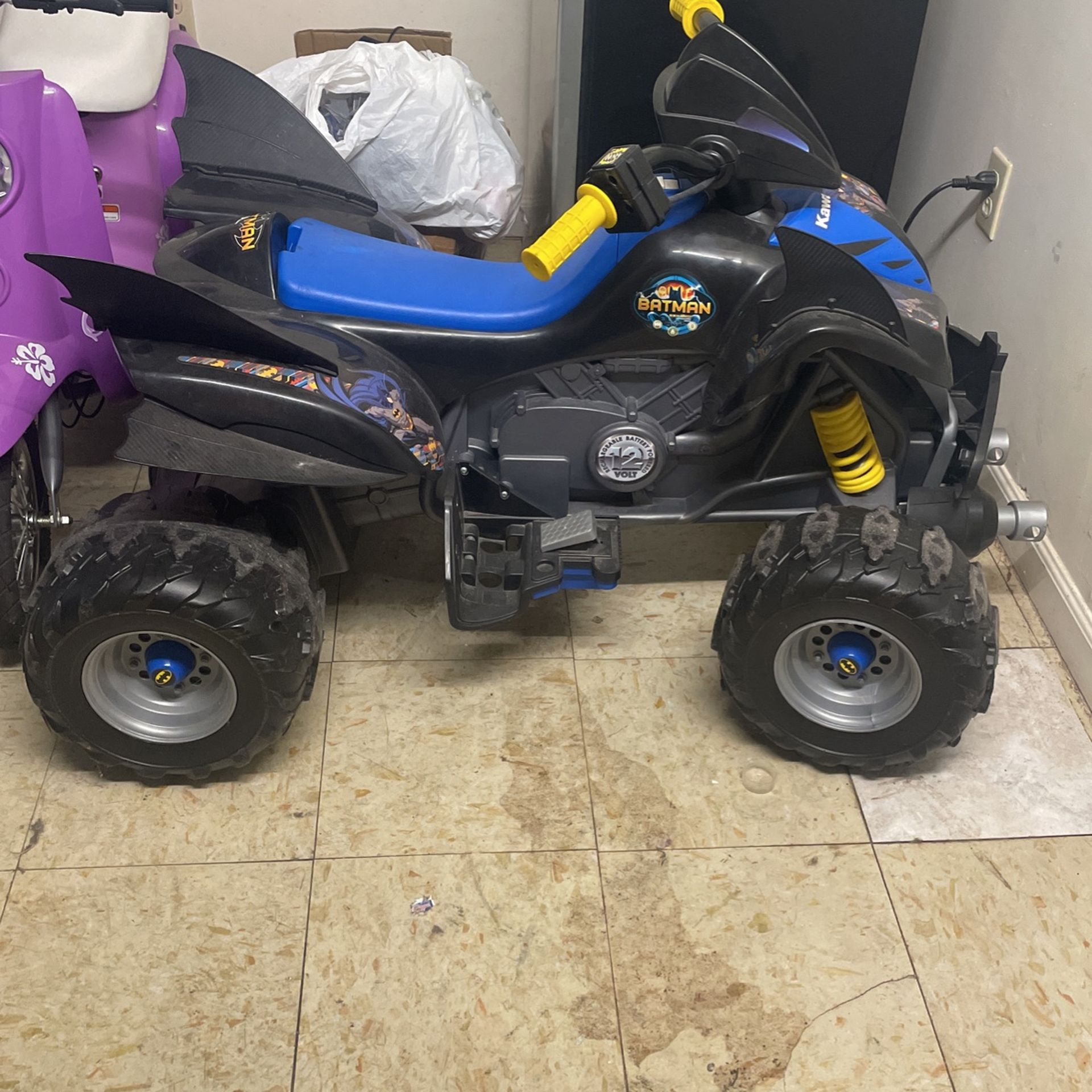 Batman four wheeler power wheel great shape runs well two different speeds front and back button with charger only road a few times