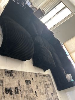 Black suede sectional with a chaise