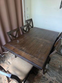 Wooden dining room table with 6 chairs