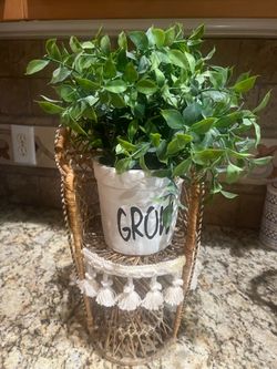 Wicker stand with fake plant