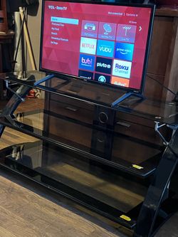 TCL Roku TV and TV stand—both items for $165.