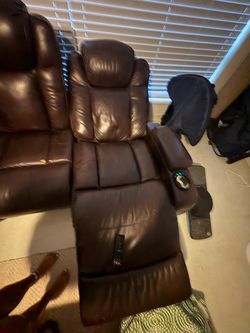 Brown Leather reclining couch with drop down center console
