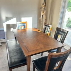 Wooden Dining room table and seating